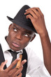 sexy black man wearing a hat and smoking a cigar sexy black man wearing a hat and smoking a cigar