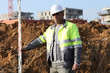 Worker holding a yardstick