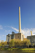 Tall chimney of powerhouse on the river Saar in Saarbrücken