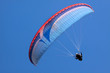 canvas print picture - Gleitschirmflieger vor blauem Himmel