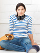 happy teenage girl in big headphones