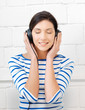 happy teenage girl in big headphones