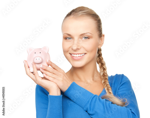 Photo: lovely woman with piggy bank lovely woman with piggy bank