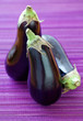 ripe eggplant on a violet background