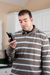 Man Holding Cordless Phone