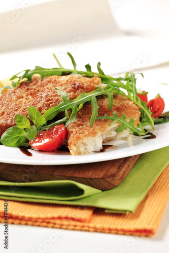 Photo: Fried fish and fresh salad Fried fish and fresh salad