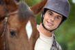 young man riding a horse young man riding a horse