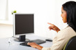 canvas print picture - Businesswoman pointing to a monitor