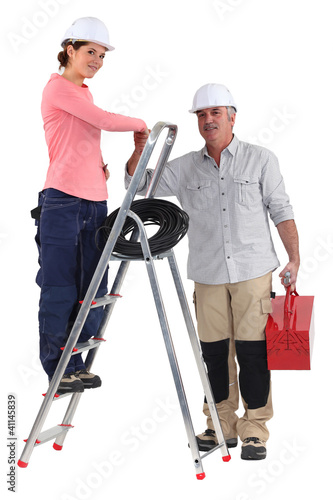 Foto: Electrician and apprentice on a ladder Electrician and apprentice on a ladder