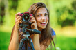 beautiful woman photographed with camera tripod beautiful woman photographed with camera tripod