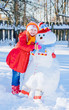 snowman and young girl