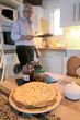 Photo: grandfather preparing a snack for his grandchildren grandfather preparing a snack for his grandchildren