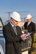 Architect man make notes on construction site