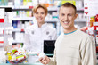 Photo: The pharmacist and the customer at the counter The pharmacist and the customer at the counter