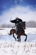 Medieval knight of St. John (Hospitallers) on a horse