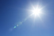 Shining sun at clear blue sky with copy space