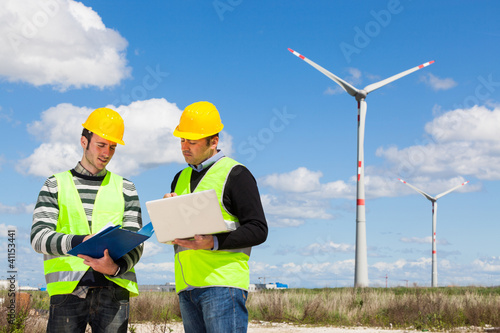 Photo: Two Engineers in a Wind Turbine Power Station Two Engineers in a Wind Turbine Power Station