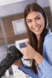 Pretty photographer giving thumb up