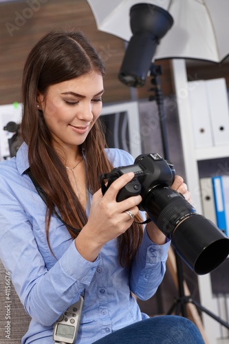 Photo: Smiling photographer at work Smiling photographer at work