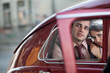 Photo: Pretty couple in the vintage car Pretty couple in the vintage car