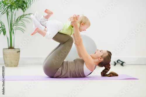 Photo: Healthy mother and baby making gymnastics Healthy mother and baby making gymnastics