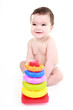Baby laughing with colourful toy