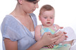 Mother teaching phone to baby