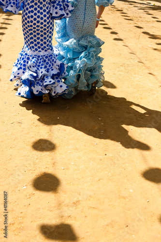 Photo: Women wearing flamenco dresses at Seville's fairground. Women wearing flamenco dresses at Seville's fairground.