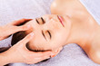 Beautiful girl receiving facial massage Beautiful girl receiving facial massage