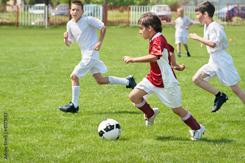 Photo: boys kicking ball boys kicking ball
