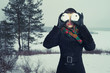 Humorous portrait of  woman with snow-balls