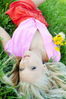 Beautiful sexy young woman outdoors, lying in the grass, relaxin