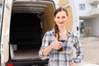 Woman in front of moving truck