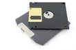ZIP and floppy disks over white
