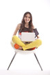 Photo en ligne au meilleur prix Full length of beautiful young girl holding laptop