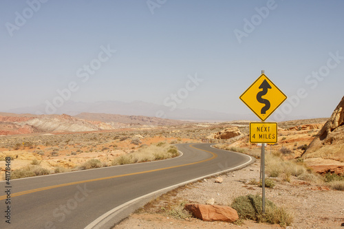 Photo: Road Sign for Curves in Desert Road Sign for Curves in Desert