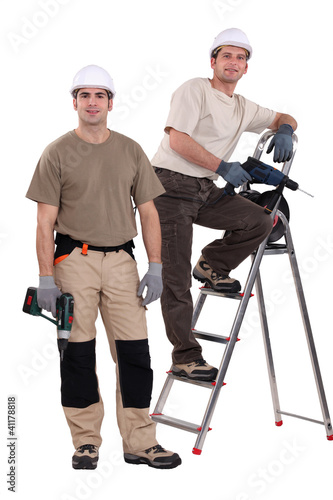 Photo: Two handyman with their driller. Two handyman with their driller.