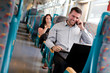 Handsome businessman working on the train