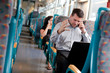 Businessman receiving bad news on a train