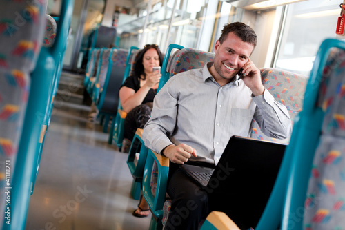 Photo: Handsome businessman working on the train Handsome businessman working on the train