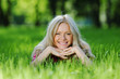 beautiful woman laying on grass