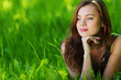 beautiful woman laying on grass