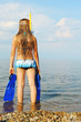 The girl on seacoast looks in a distance The girl on seacoast looks in a distance