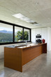 House in cement, interior, wooden kitchen island House in cement, interior, wooden kitchen island