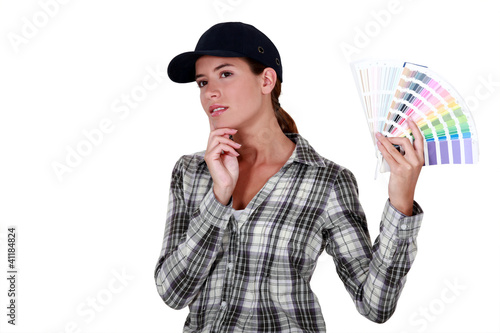 Photo: A woman holding a color model. A woman holding a color model.