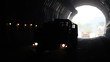 Car walks into light in a tunnel. Car walks into light in a tunnel.