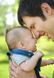 Father with his son. Focus on babies face Father with his son. Focus on babies face