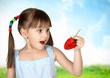 Funny surprised child girl with strawberry