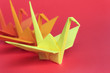 Three paper birds on a red background