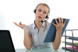 Blond receptionist wearing head-set